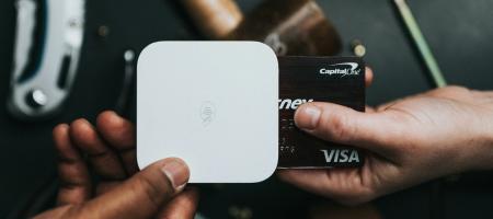 https://unsplash.com/photos/person-holding-visa-card-and-white-device-lvWw_G8tKsk